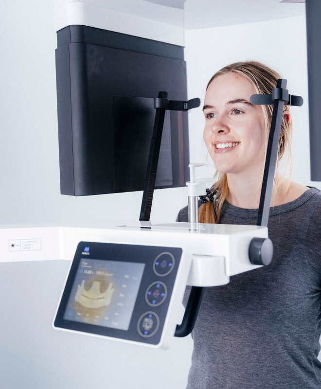 Woman using dental imaging technology