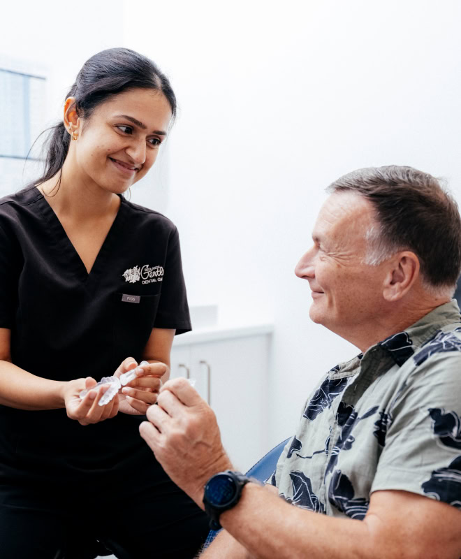 Dentist and patient discussing dental care options.