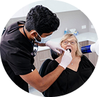 Dentist examining patient in dental office.
