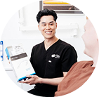 Dentist explaining dental product to patient.