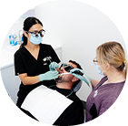 Dentists treating patient in clinic.