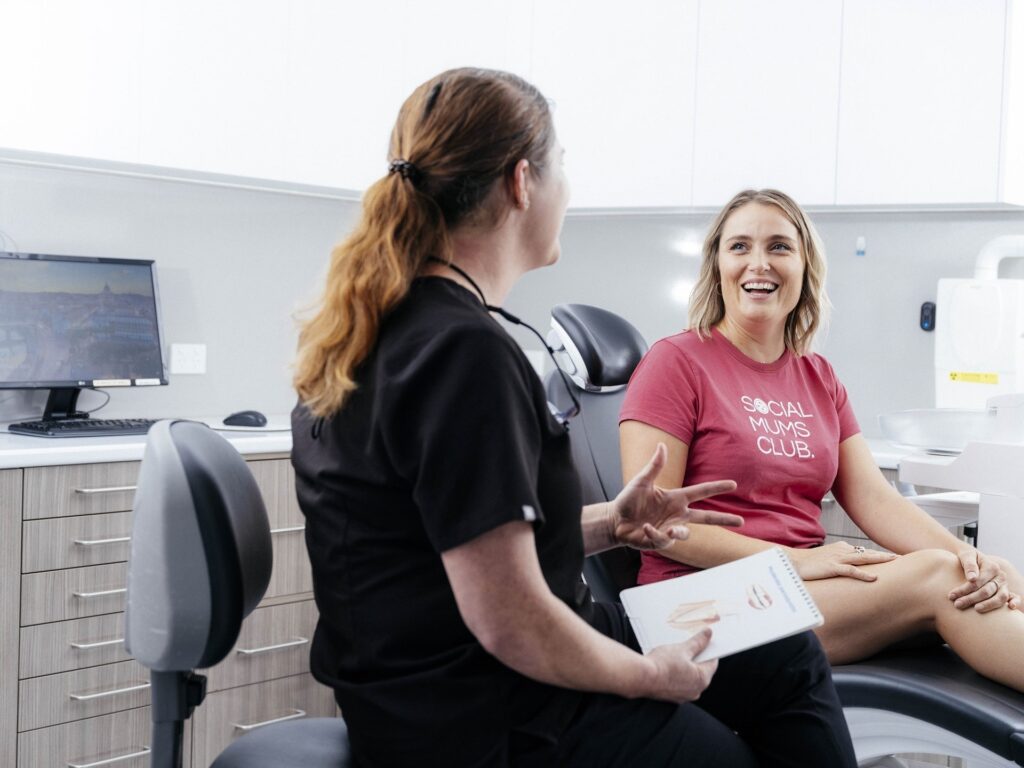 Dental consultation with smiling patient
